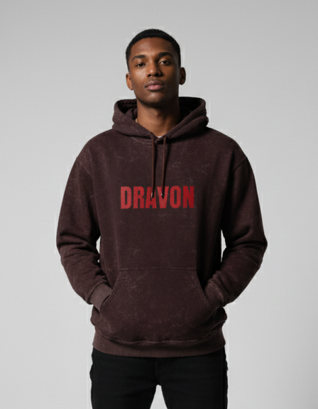 Person wearing a brown hoodie with 'DRAVON' printed in red on a gray background